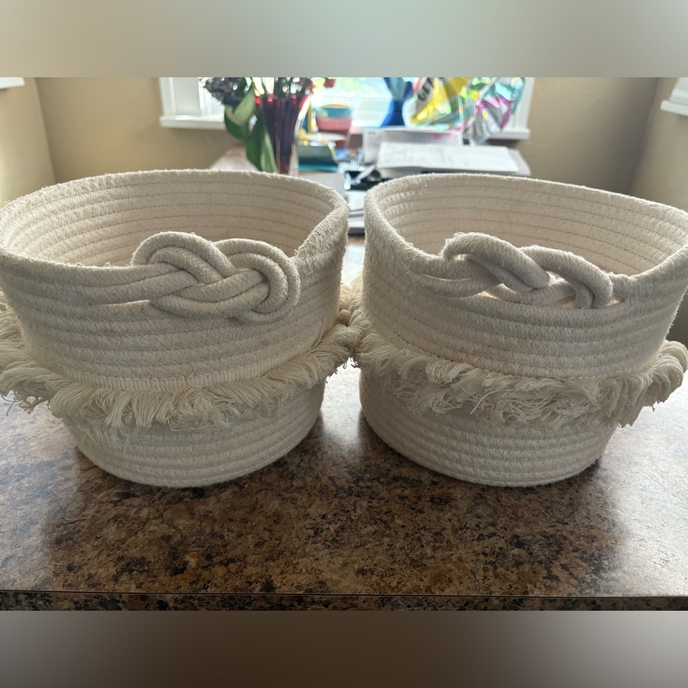 Matching baskets/bins. Woven material, white, off-white, color.